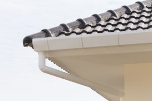 Clear gutter run along a New Orleans roof edge