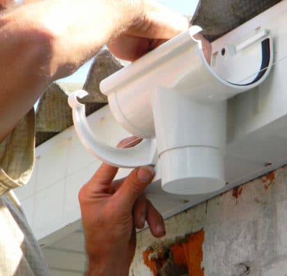 installing plastic gutter - Big Easy Gutter